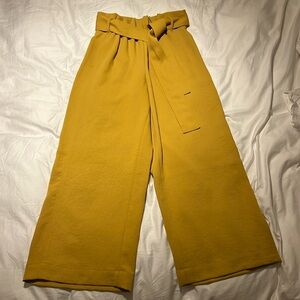 Wilfred Paperbag Pant in mustard yellow (different color shown in model image).